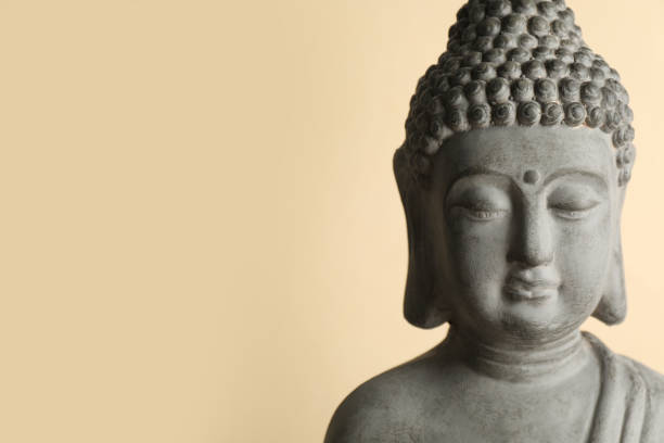 istock Beautiful stone Buddha sculpture on beige background. Space for text 1323492677