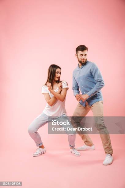 Full Length Portrait Of A Happy Young Couple Stock Photo - Download Image Now - Couple - Relationship, Dancing, Quarantine