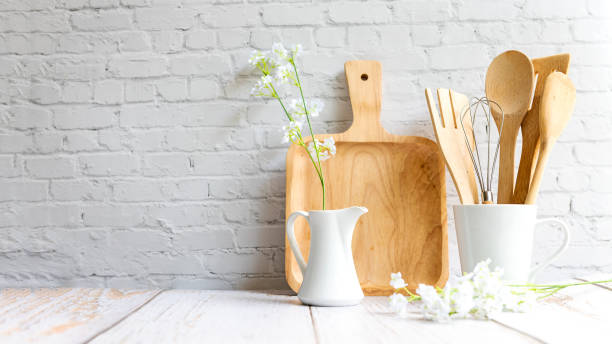 Kitchen tools and kitchenware utensil object on kitchen shelf wood white for healthy eat and health care life.  Wall white brick background, copy space for text