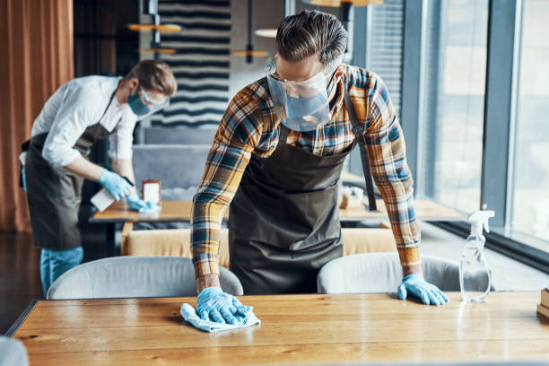 istock Two male waiters in protective workwear 1323495515
