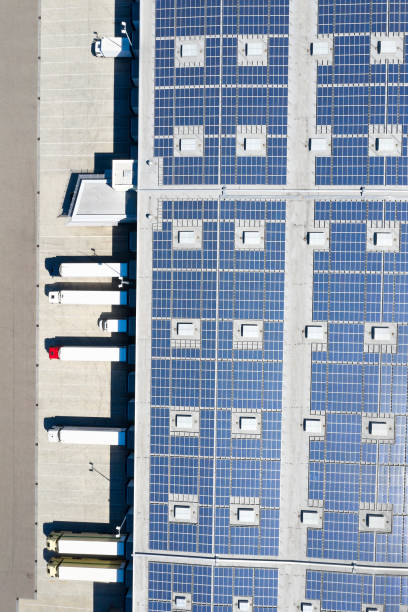 istock Distribution Warehouse with Solar Panels and Trucks from Above 1323497005