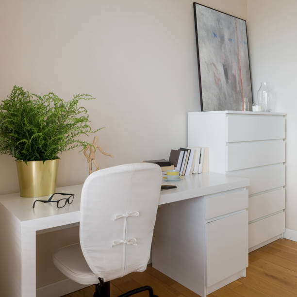 istock Cozy home office with white furniture 1323499637