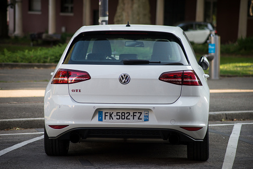Mulhouse - France - 13 June 2021 - rear view of white Volkswagen Golf GTI MK7 parked in the street