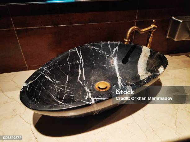 Black Marble Sink And Faucet In Bathroom Washroom Toilet Stock Photo - Download Image Now