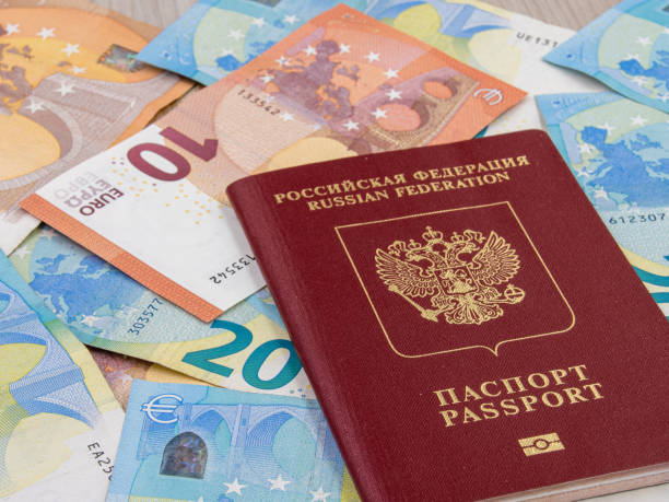 istock Russian foreign passport and euro banknotes 1323507360