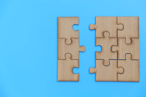 istock jigsaw puzzle pieces on blue background, Team business concept 1323507387