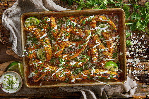 Made Famous on Social Media- Dry Rubbed BBQ Corn Ribs with Lime Crema, Cotija Cheese and Cilantro