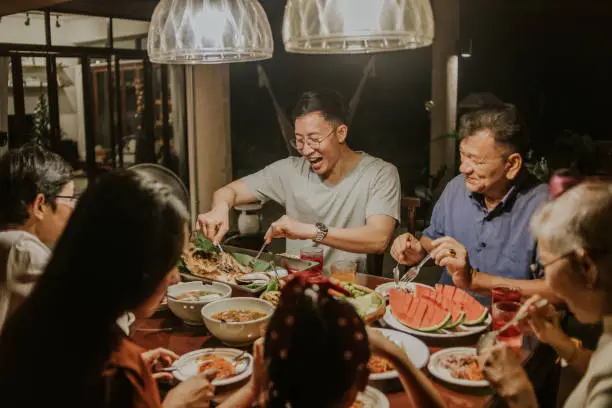 Photo of Local Thai-Chinese family having party dinner-stock photo