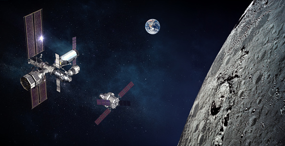 Space module docking above the moon surface. Two spaceships and the planet Earth in space near the moon. The elements of this image furnished by NASA.\n\n/nasa urls used for this collage:\nhttps://www.nasa.gov/feature/goddard/2021/nasa-explores-upper-limits-of-global-navigation-systems-for-artemis\n(https://www.nasa.gov/sites/default/files/thumbnails/image/gateway_canadarm.png)\nhttps://images.nasa.gov/details-as17-145-22285.html\nhttps://images.nasa.gov/details-as17-148-22727.html