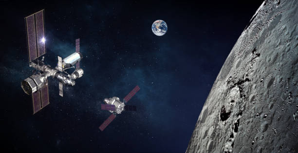 Space module docking above the moon surface. Two spaceships and the planet Earth in space near the moon. stock photo