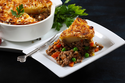 Cottage Pie with minced beef and Shepherds Pie with minced lamb topped with mash potato and grated cheese, a traditional British meal. High resolution 45Mp using Canon EOS R5 and associate lenses