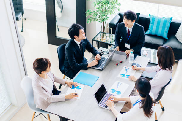 istock Business persons working in an office 1323510522