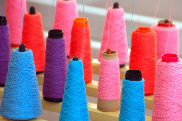 istock Closeup of color threads on spools 1323511263