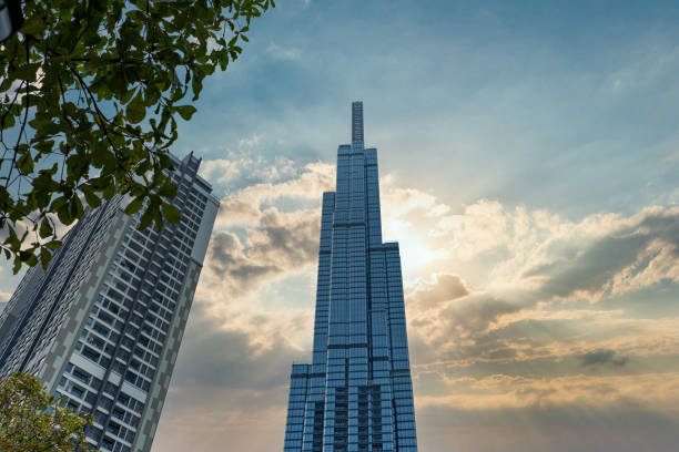 istock Low angle view of high rise building with sunrise sky background 1323511551