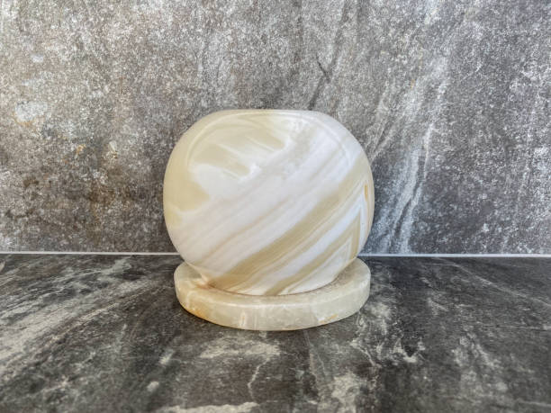 istock A close-up onyx candle holder stands on a grey marble table 1323513457