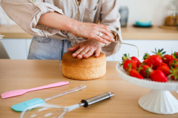 istock A pastry chef bakes a cake in the home kitchen. Home business. 1323514247