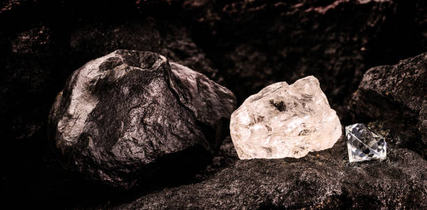 istock diamond mine with rough diamond stone, cut diamond and carbon or graphite ore, on kimberlite rocks, transformation into rare stone concept 1323514276