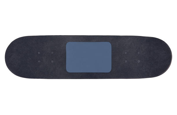 istock Close up black skateboard with tablet pc blank dark screen isolated on a white background, flat lay, top view 1323516502