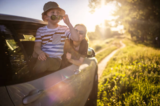 istock Mother and son traveling by car 1323520093