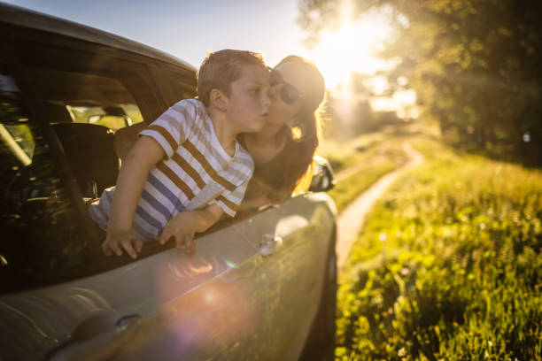 istock Mother and son traveling by car 1323520122