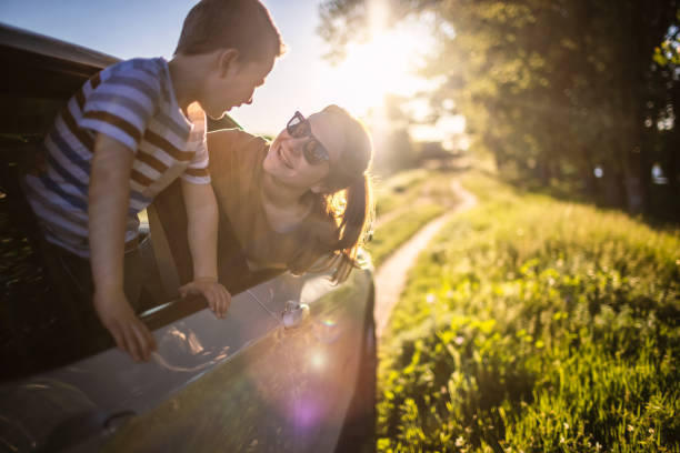 istock Mother and son traveling by car 1323520150