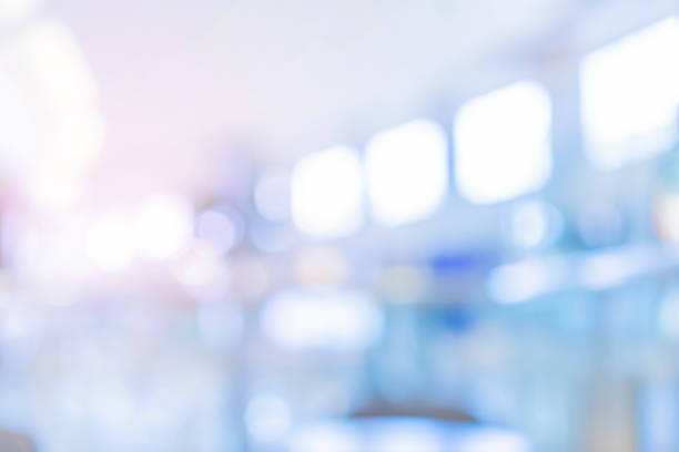 istock abstract blur soft focus blue color interior of modern cleaning workplace background with orange shine light for design concept 1323521481