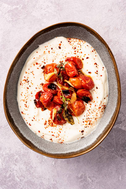 istock Oven Baked Cherry Tomatoes with Greek Yoghurt 1323521899