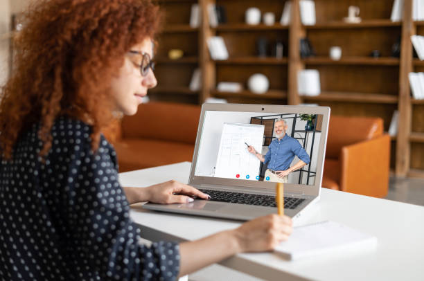 istock Curly female student watching online educational webinar 1323522076