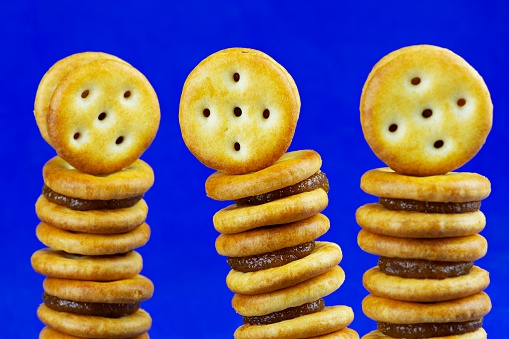 3 stacks of Pineapple stuffed biscuits - blue background.