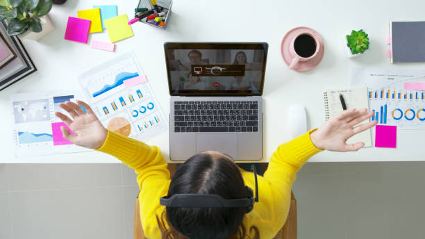 istock Overhead top view young asian woman employee work from home using computer notebook videocall meeting conference angry annoy with low poor unreliable internet wifi connection problem issue outage. 1323527550