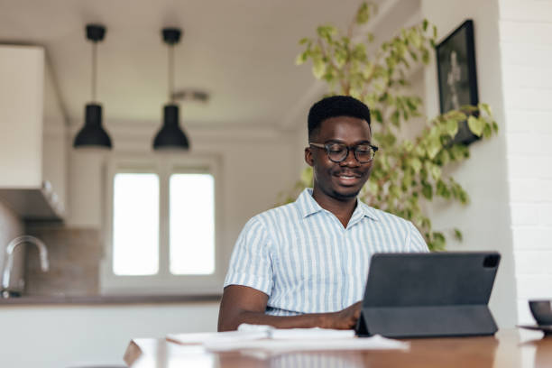 istock Adult man, doing his taxes on regular basis. 1323528438