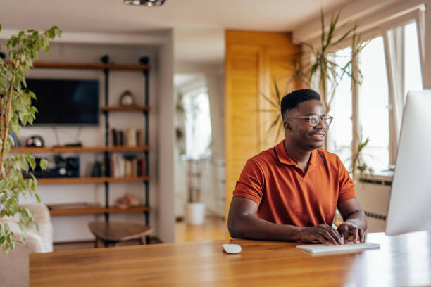 istock Adult man, working on his assignment, from home office. 1323528442