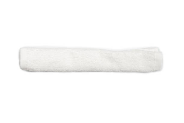 istock White fluffy cotton towel isolated on a white background. 1323530233