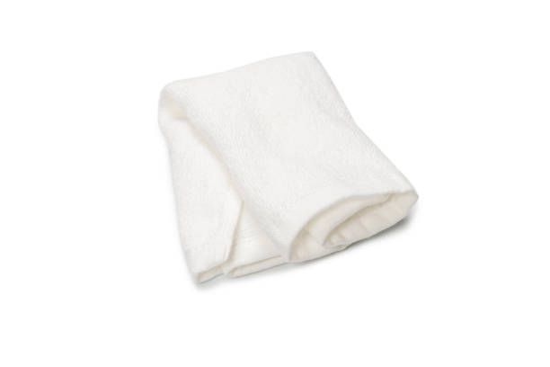 istock White fluffy cotton towel isolated on a white background. 1323531333