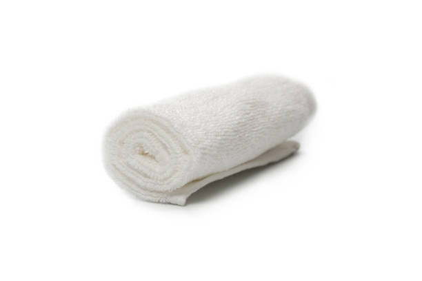 istock White fluffy cotton towel isolated on a white background. 1323531340