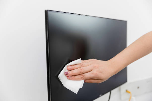 istock Wiping down the computer monitor 1323538288