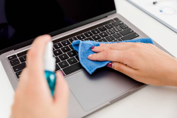 istock Cleaning keyboard of a laptop with disposable damp cloth 1323538428