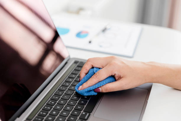 istock Cleaning keyboard of a laptop with disposable damp cloth 1323538449