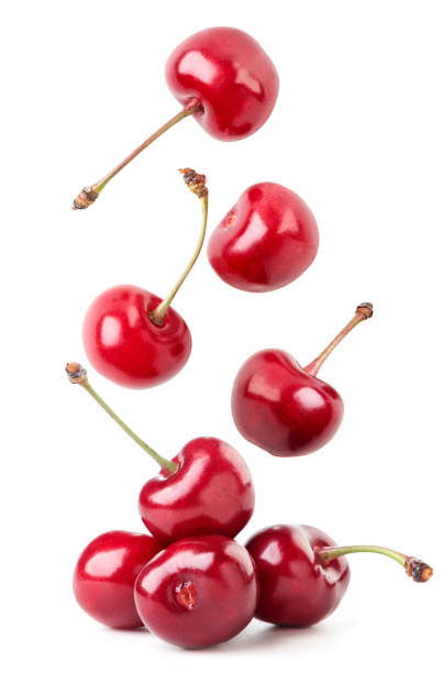 istock Ripe cherry berries fall on a white background. Isolated 1323539416