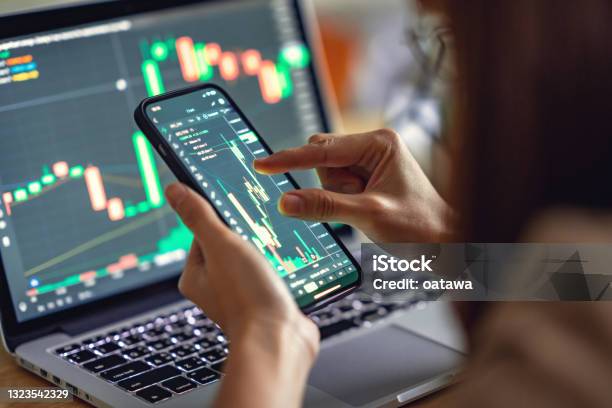 Woman Is Checking Bitcoin Price Chart On Digital Exchange On Smartphone Cryptocurrency Future Price Action Prediction Stock Photo - Download Image Now