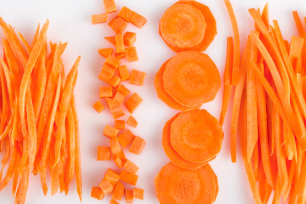 istock Fresh, sliced carrot on a white background. 1323543011