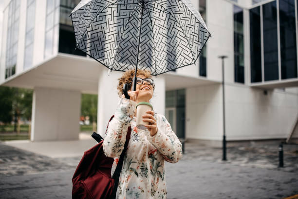 istock Young woman enjoying rainy day 1323543835