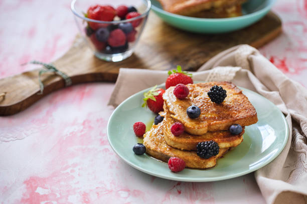 istock French Toast with Berries and Maple Syrup 1323545188