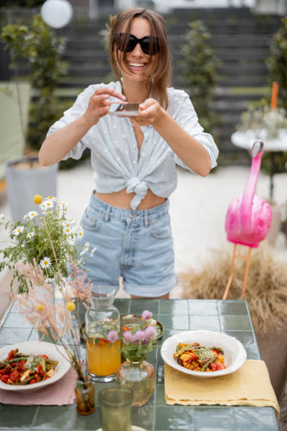 Woman decorating dining table outdoors