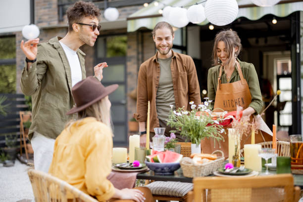 istock Friends preparing for the festive dinner outdoors 1323549871