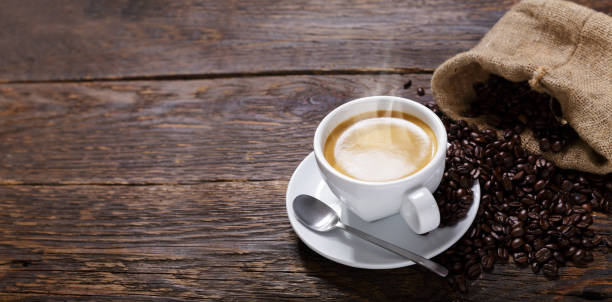istock cup of coffee and coffee beans on a wooden table 1323550110