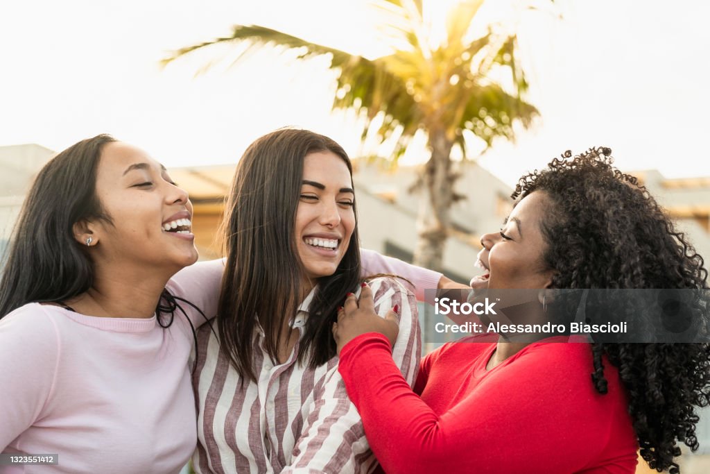 Happy multiracial friends having fun in the city - Young people lifestyle concept Friendship Stock Photo