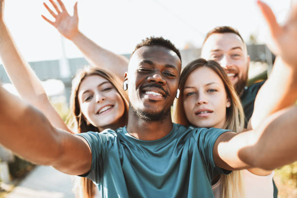 istock Smiling Multiethnic Friends Expressing Happiness While Working Out Outside 1323551486