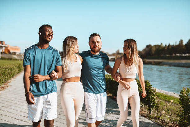 istock Running Date For Multiethnic Couples On River Quay Outside 1323551549