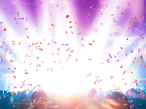 istock Concert spectators in front of a bright stage with live music 1323552003